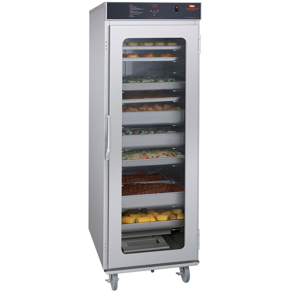 A Hatco holding and proofing cabinet with several trays of food.