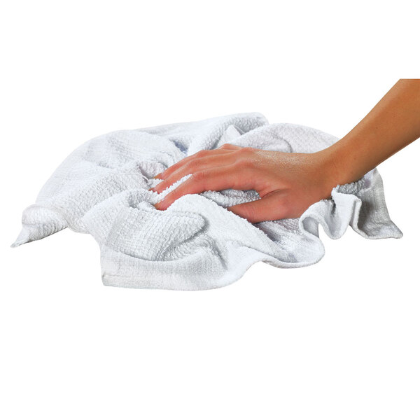 A person's hand holding a white Chef Revival bar towel.