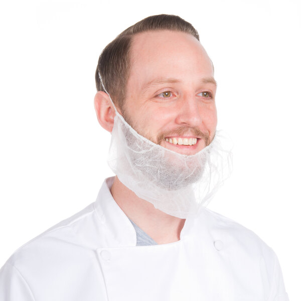 A man wearing a white coat and a Disposable Polypropylene Beard Cover.