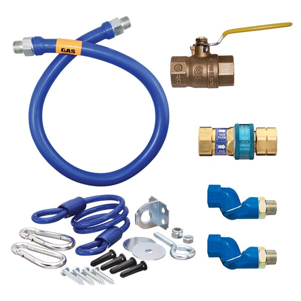 A blue Dormont gas connector kit with fittings and a yellow restraining cable.