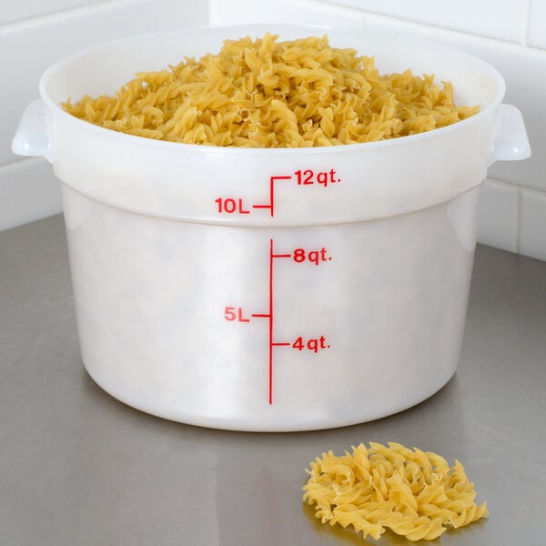 A white Cambro food storage container with noodles in it.