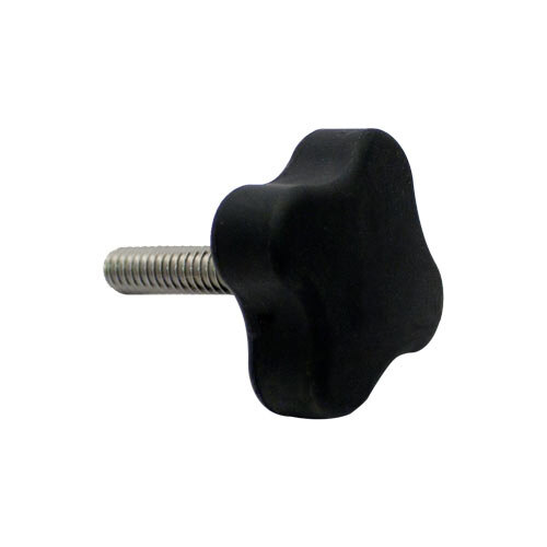 A close-up of a black knob with a star-shaped screw on it.