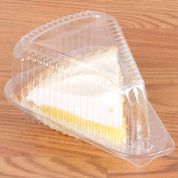 A slice of cake in a Polar Pak clear plastic container.