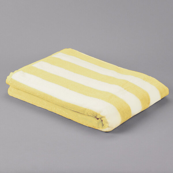 A yellow and white striped Oxford pool towel.