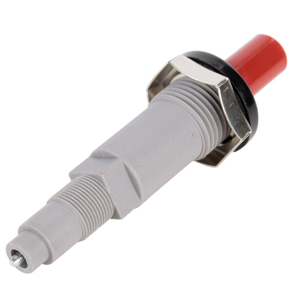A grey and red spark plug with a red and white plastic connector.