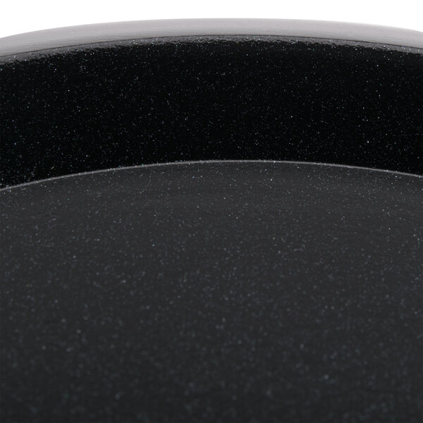 An Avantco black ceramic warming plate.