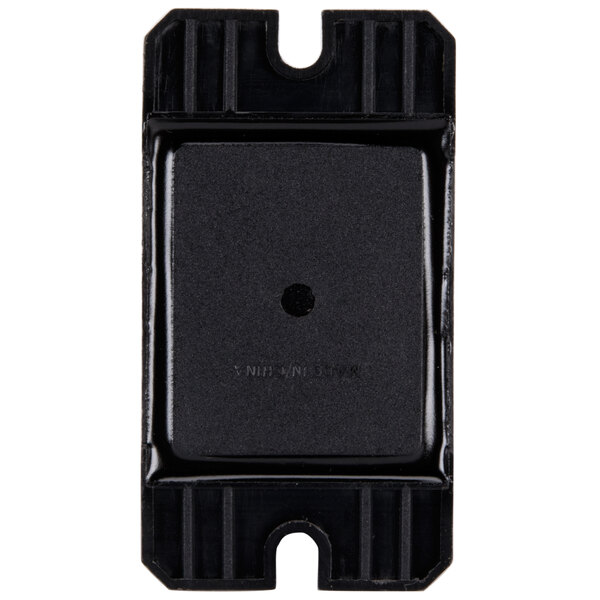 A black square object with a black circle in the center.