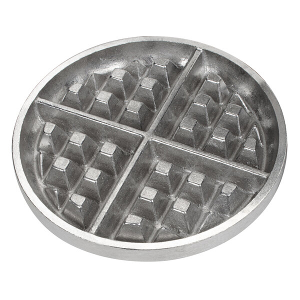 A round metal pan with four square waffle grids.