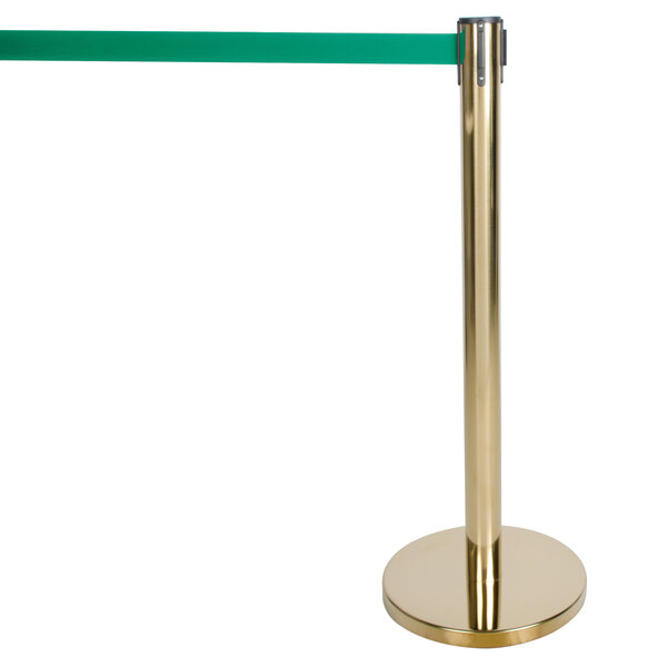 A gold pole with a black top and a green tape with a gold base.