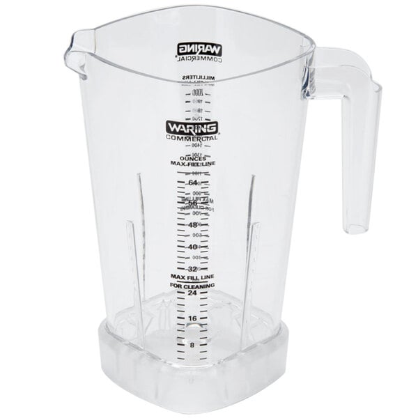 A clear plastic Waring blender jar with a handle and measuring cup.