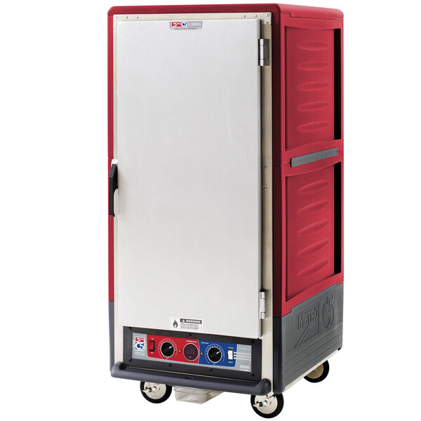 A red rectangular Metro C5 heated holding and proofing cabinet with wheels.