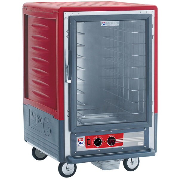 A red Metro C5 half size heated holding cabinet with clear door.
