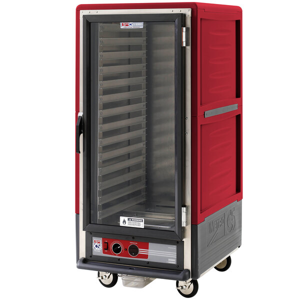 A red metal Metro heated holding cabinet with a clear door.
