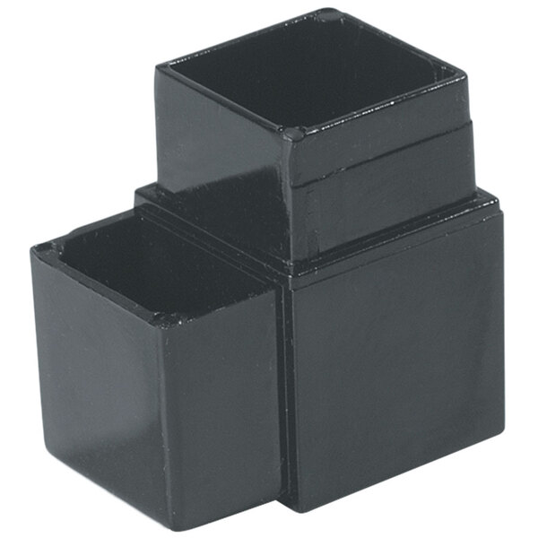A black rectangular object with two prongs on one side.