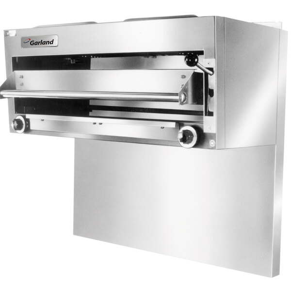 A close-up of a stainless steel Garland countertop salamander broiler with a shelf and a door.