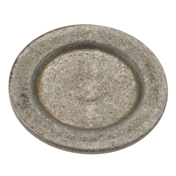 A round gray metal plate with a hole in the middle.