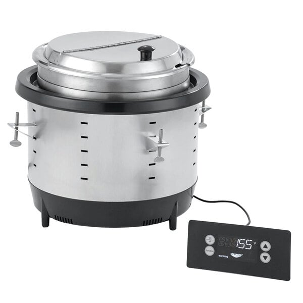 A large silver drop-in induction warmer with a black and digital display.