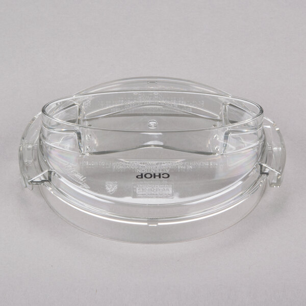 A clear plastic container with a chopping lid on top.