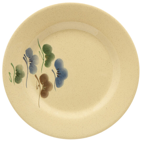 A white GET Tokyo melamine plate with a flower design.