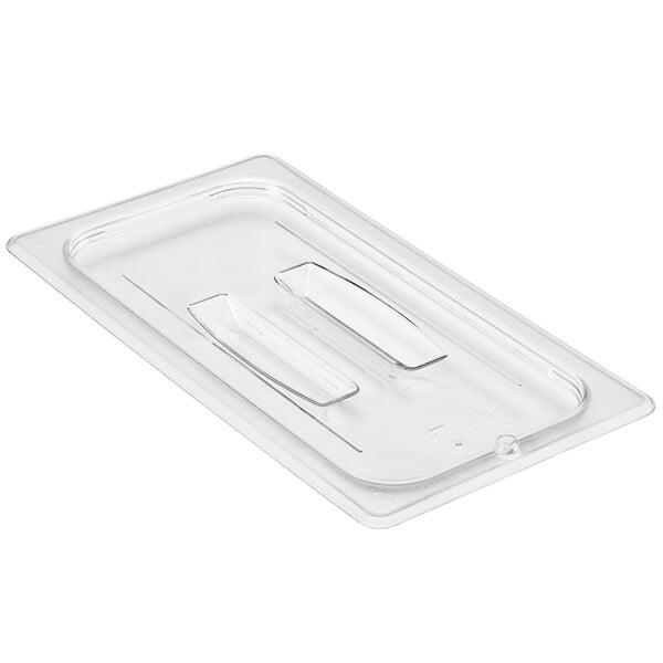A clear plastic tray with a Cambro clear polycarbonate handled lid on it.