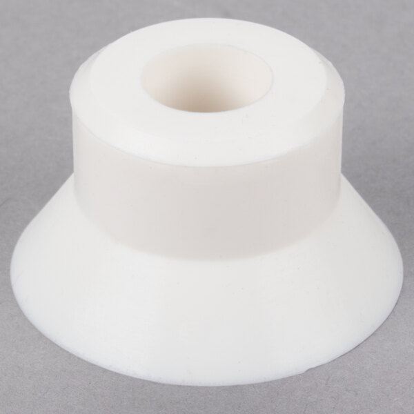 A white plastic Cecilware rear motor shaft seal.