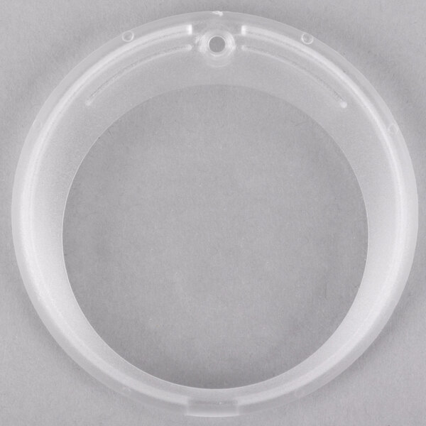 A clear plastic ring with holes.