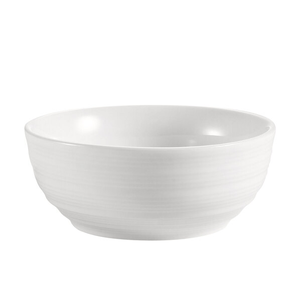 A close-up of a CAC New Bone White Porcelain small bowl.