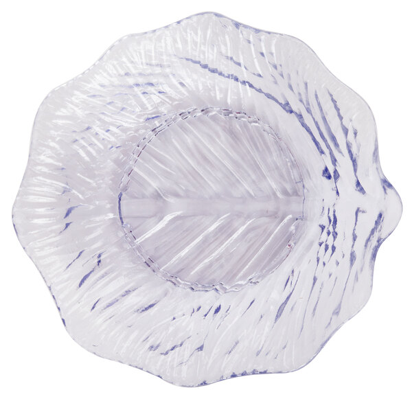 A clear plastic plate with a leaf design.