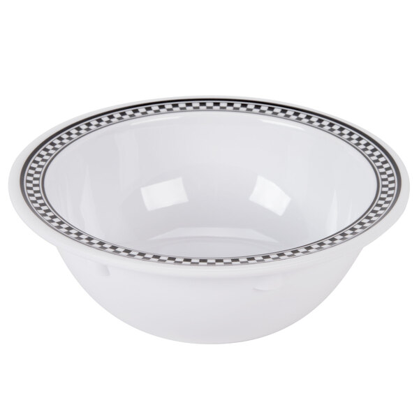 A white melamine bowl with black and white diamond checkered design.