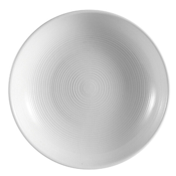 A white porcelain bowl with a circular pattern of spirals.