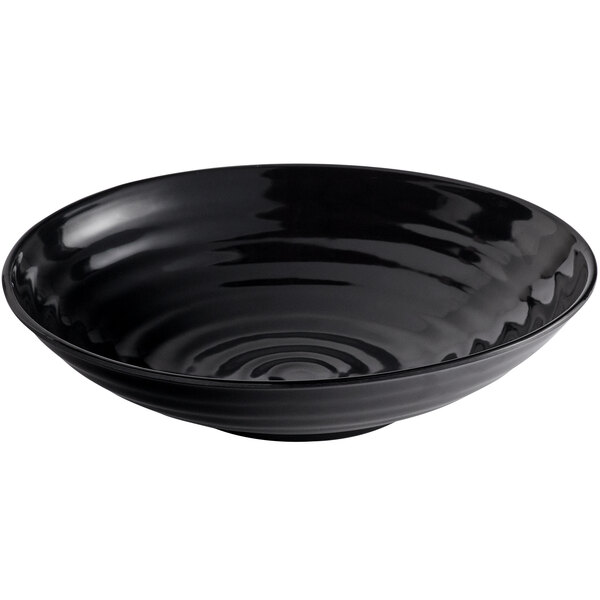 A black melamine bowl with a ripple design.