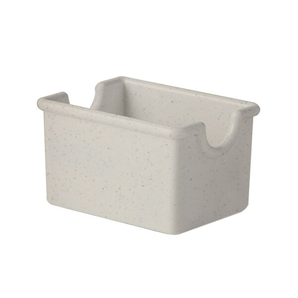 A white plastic sugar caddy with a white speckled surface and a handle.