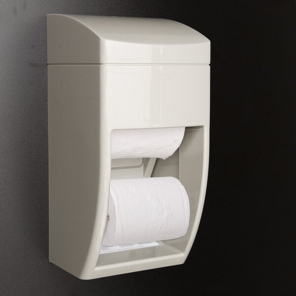 A white Bobrick MatrixSeries surface-mounted multi roll toilet paper dispenser with two rolls.