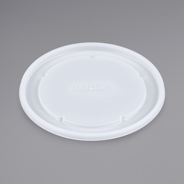 A white plastic lid with the Dinex logo on it.