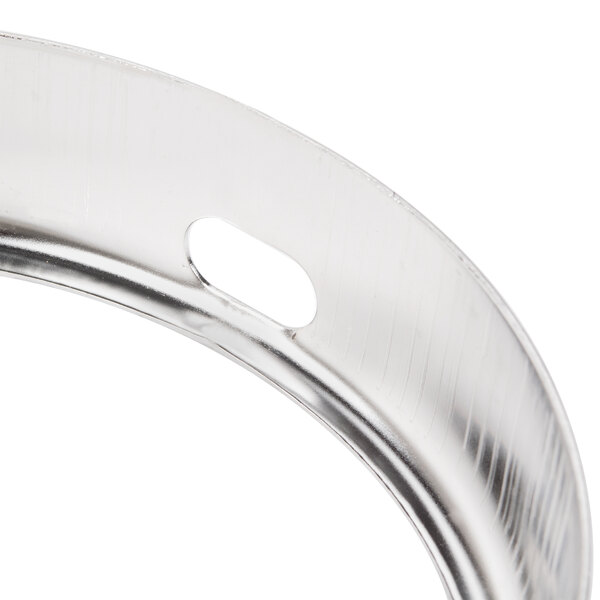 A close-up of a stainless steel bowl guard for an Avantco MX10 mixer.