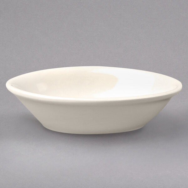 A Homer Laughlin ivory china baker dish with rolled edges.