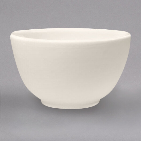 A Homer Laughlin ivory china bouillon bowl with a rolled edge.