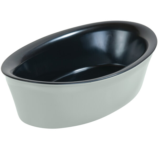 A black and white oval crock with a black rim.