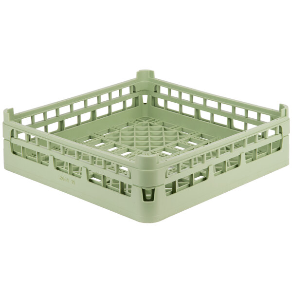 A Vollrath light green plastic dish rack with holes.