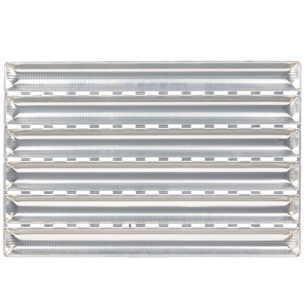 A Matfer Bourgeat baguette pan with six compartments on a metal surface.