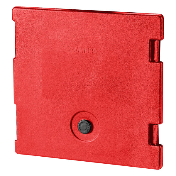 A red plastic Cambro door with a round black button.