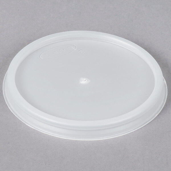 A Dart translucent plastic lid with a small vented hole.