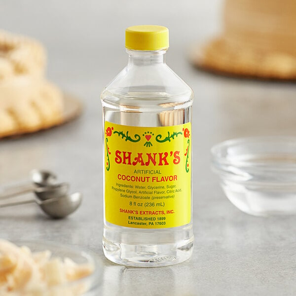 A close up of a bottle of Shank's Imitation Coconut syrup.
