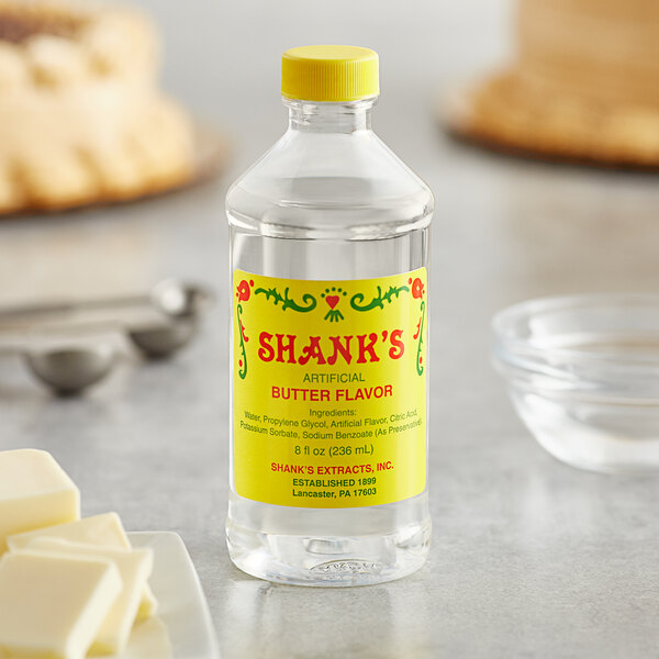 A bottle of Shank's Imitation Butter on a table.