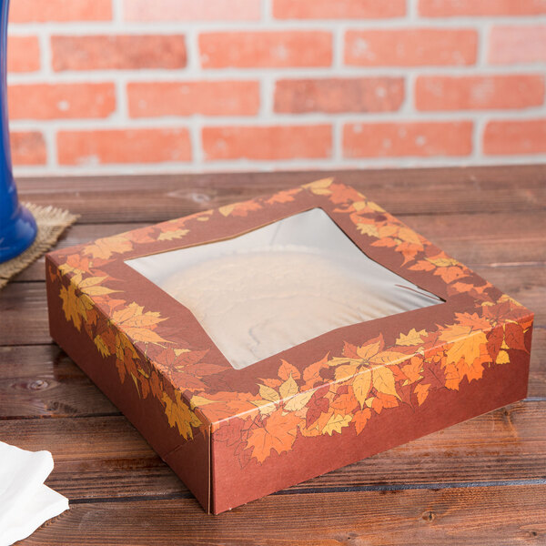 A Rustic Orange bakery box with a window and autumn leaf design.