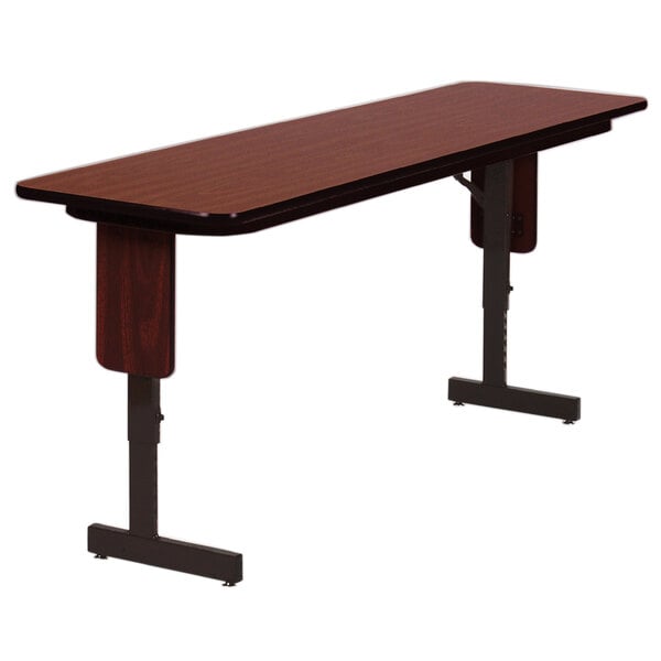 A Correll rectangular medium oak seminar table with black panel legs.