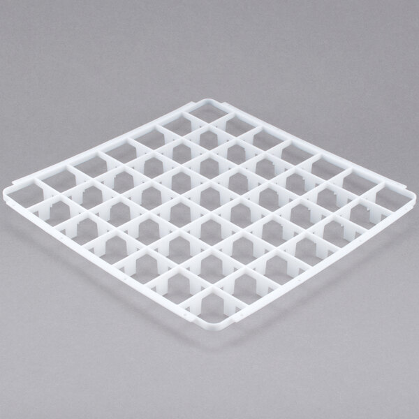 A white plastic grid with square compartments and holes.
