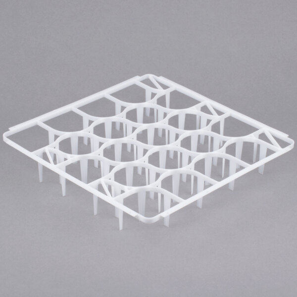 A white plastic Vollrath glass rack divider with holes.