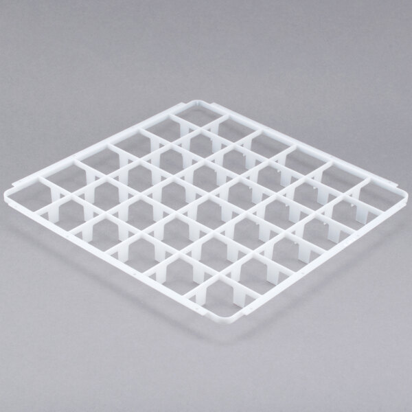 A white plastic tray with square holes.