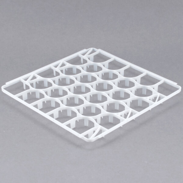 A white plastic grid with holes.